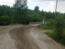 В Бодайбинском районе Иркутской области восстановили движение по разрушенному паводком мосту через Бисягу